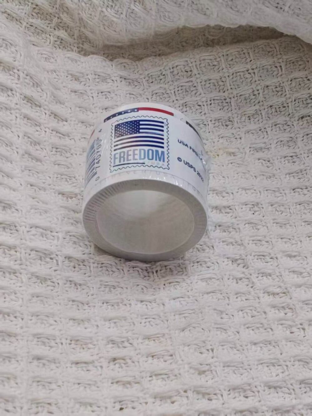 One roll of USPS stamps, 100 brand new